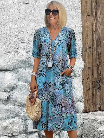 Helen | Elegante maxi-abito con stampa floreale giocosa